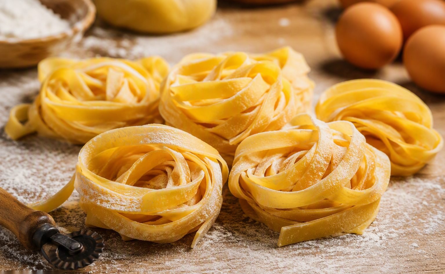 Illustrative image — Golden tagliatelle nests and fettuccine strands on drying racks in a pasta production facility